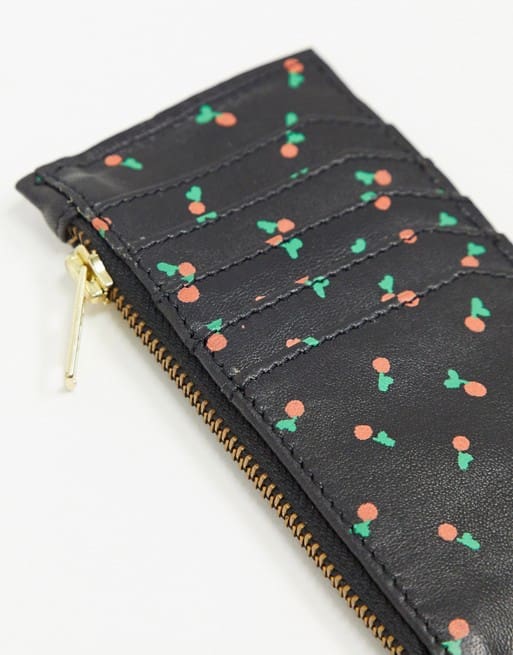A black leather cherries pouch.