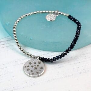 A Silver Plated Stacking Bracelet with a crystal star charm.