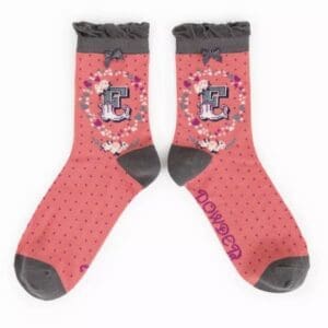 A pair of pink and gray socks with flowers on them, import Import placeholder for 7028.