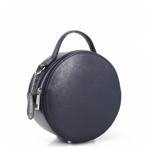 A round leather bag with a zipper on the side.