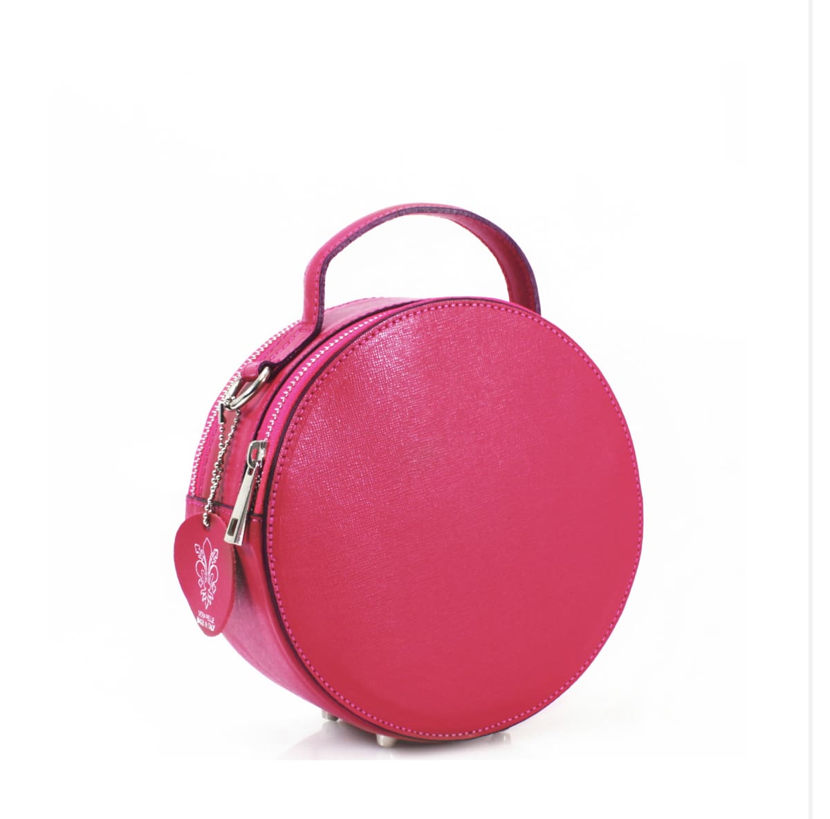 A round pink leather bag with a metal handle.