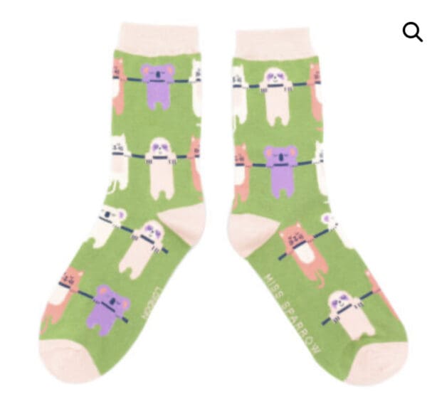 A pair of green socks with bears on them.