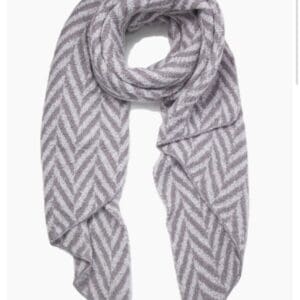 A grey and white scarf with a chevron pattern.