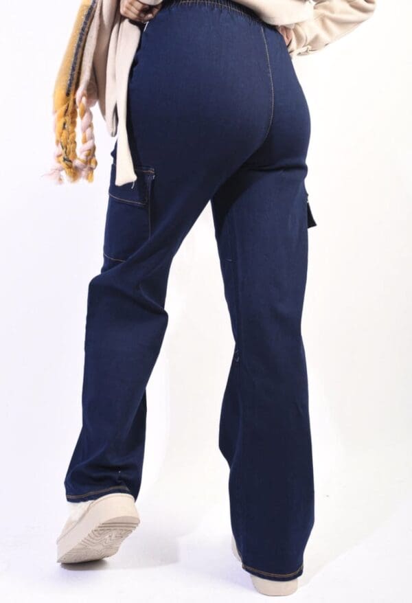The back view of a woman wearing navy cargo pants.