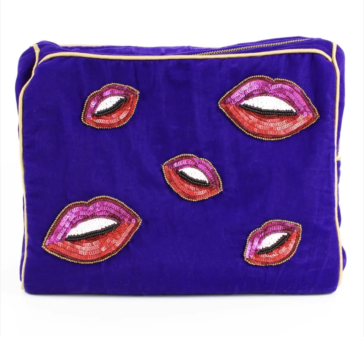 A purple cosmetic bag with red lips on it.