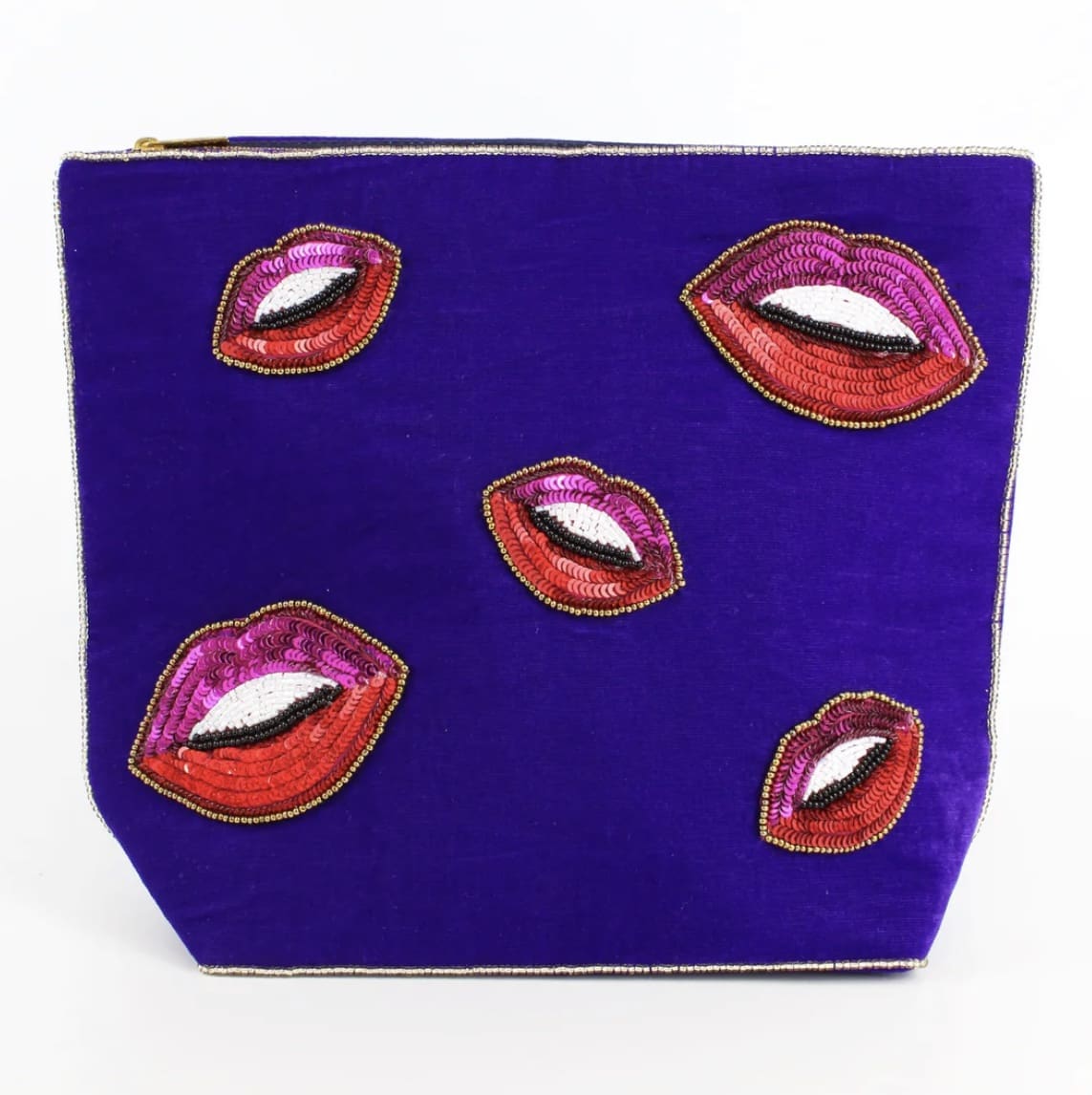 A purple cosmetic bag with lips on it.