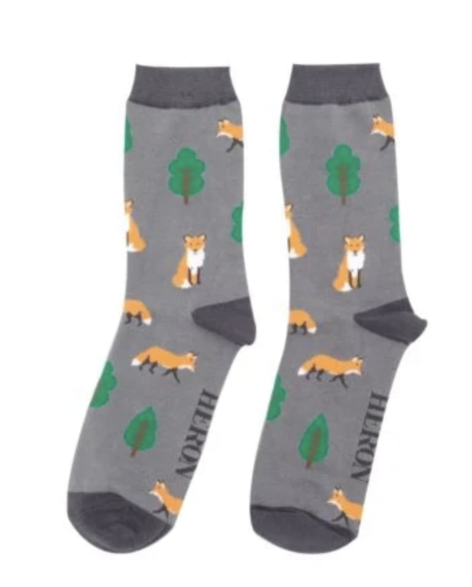 A pair of grey socks with foxes on them.