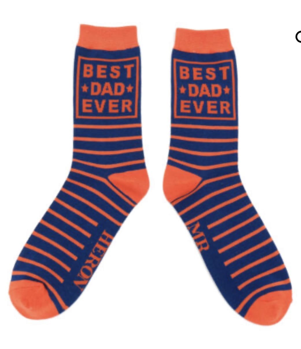 A pair of socks that say best dad ever.