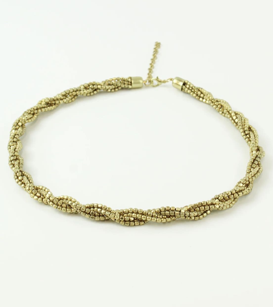 A gold braided choker on a white background.