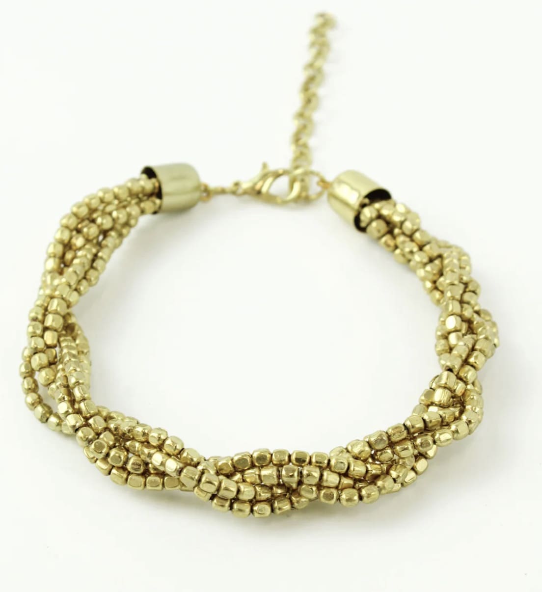 A gold bracelet with a chain.