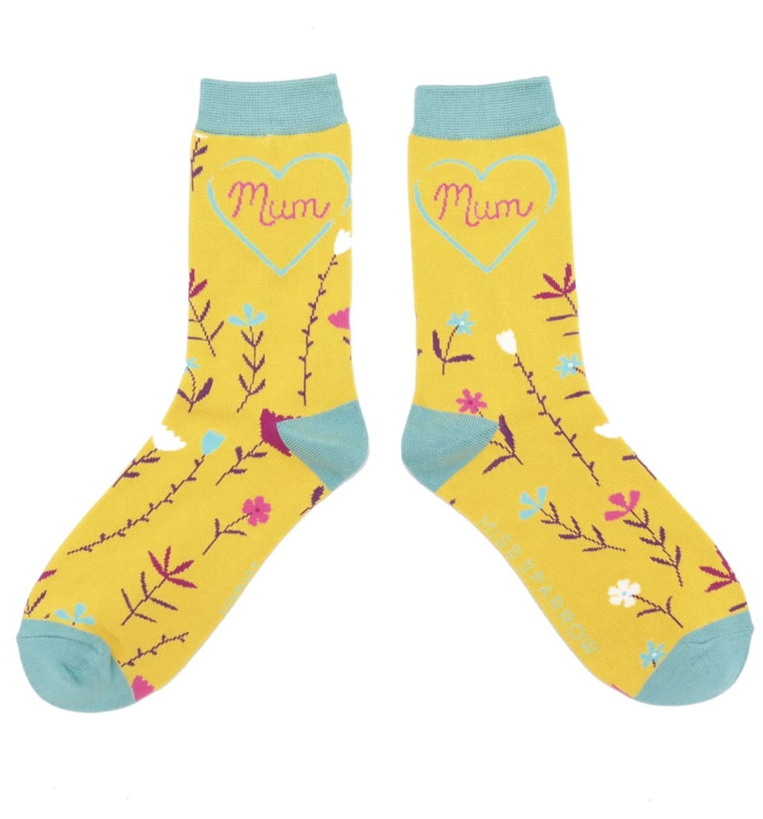 A pair of yellow socks with the word mom on them.