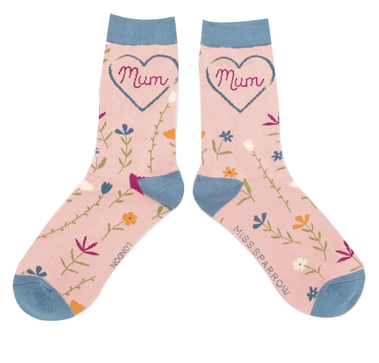 A pair of pink socks with the word mum on them.